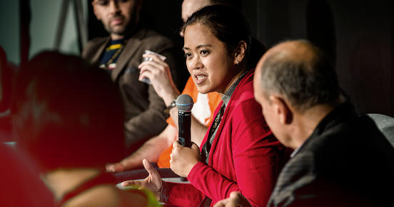 Woman gives a speech on stage