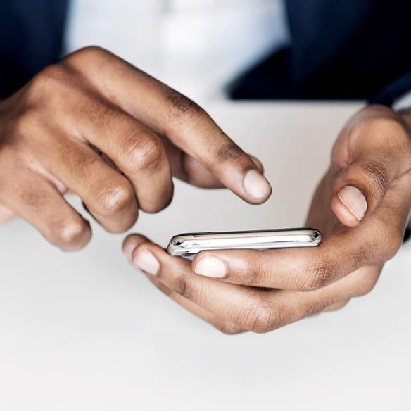 Closeup of hands with mobile phone