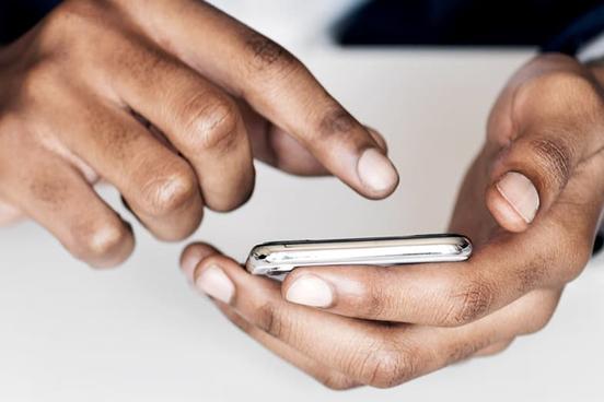 Closeup of hands with mobile phone