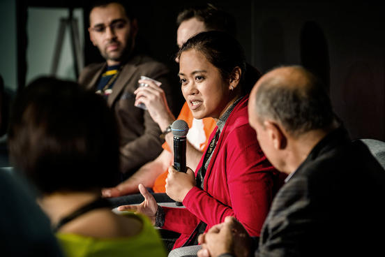 Woman gives a speech on stage