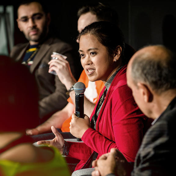 Woman gives a speech on stage