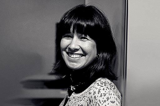 A woman in portrait smiles into the camera